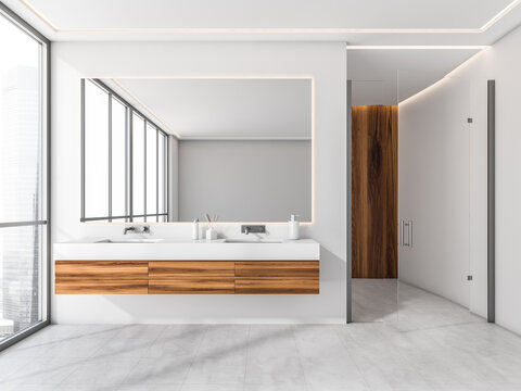 White shower room with wood details