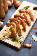 Grilled german sausage links with sauerkraut
