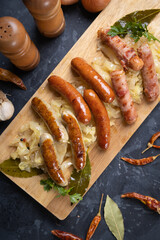 Grilled german sausage links with sauerkraut