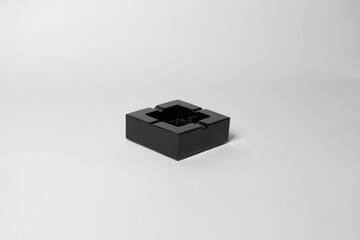 Black ashtray , Empty black ceramic ashtray , Empty black ceramic ashtray isolated on white