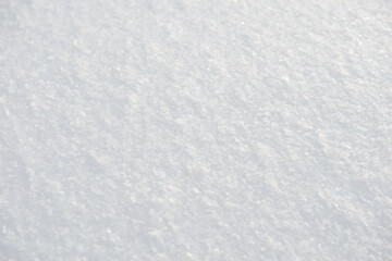 The surface of a fluffy snowdrift on a winter day