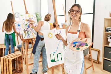 Group of young people smiling happy drawing at art studio