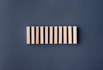 Wooden rectangular blocks on a gray-blue background. Loading indicator. Loading bar.