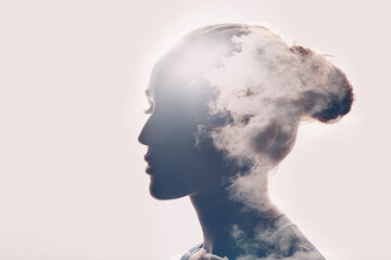 Psychology and caucasian woman mental health concept. Multiple exposure clouds and sun on female head silhouette. - 471809530