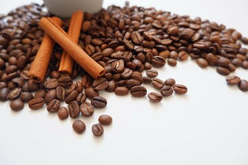 Coffee beans, Cinnamons and cup on white background. Cafe, Coffee, restaurant design elements. 
