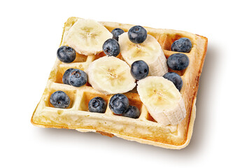 French waffles with blueberries and bananas top wiev