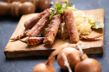 Grilled german sausage links with sauerkraut