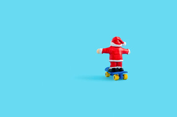 New year concept with Santa Claus figurine on the skateboard
