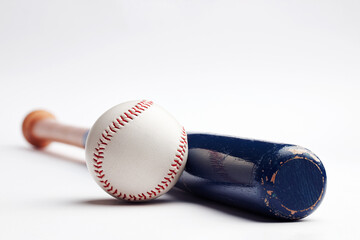 Baseball ball and blue wooden bat on white background with copy space