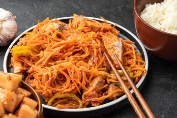 Korean recipe for marinated lakedra fish salad with carrots.