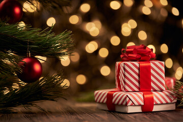 Christmas gift box and trinkets on a background of unfocused golden lights. - 471815994