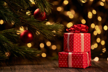 red boxes with gifts on a festive Christmas background.