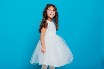 Fototapeta na wymiar beautiful little girl in white dress as princess queen