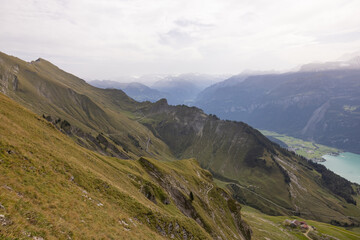 Fototapeta premium Amazing hiking day in the alps of Switzerland. Wonderful view over a beautiful lake called Brienzersee. What an amazing view.