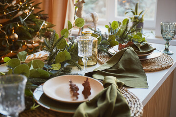 table decorated for christmas dinner