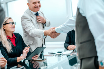 close up. businesswoman congratulating employees on success