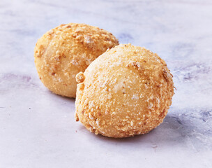  Two delicious mochis on a marble surface