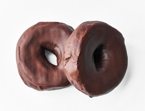  Two delicious chocolate doughnuts isolated on a white background