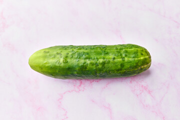  Single cucumber on a marble surface