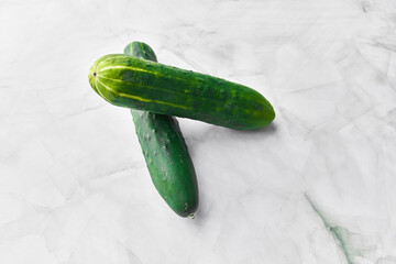  Bunch of cucumbers on a marble surface