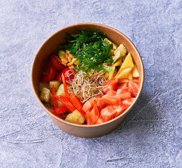  Delicious take away poke bowl on a concrete surface