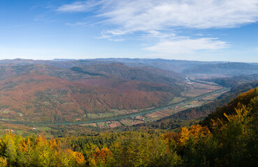 Fototapeta na wymiar View of the Drina river valley towards Bajina Basta from the Oslusa lookout in the Tara National Park, Serbia.