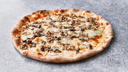  Delicious mushroom italian pizza on a concrete surface