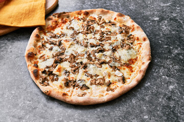  Delicious mushroom italian pizza on a concrete surface