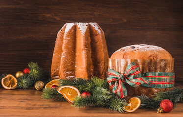Pandoro and panettone traditional Italian Christmas  cake on wooden background copy space.