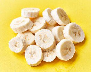  Slices of banana on a yellow background