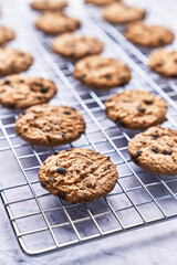  Chocolate cookies served on a grid rack on a marble table