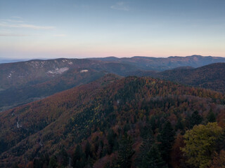 Viewpoint Sjenic in Tara National Park, view of the village in the valley and forested mountains in Serbia