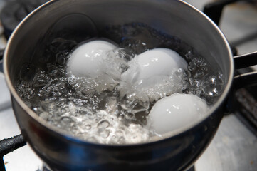 chicken eggs in boiling water