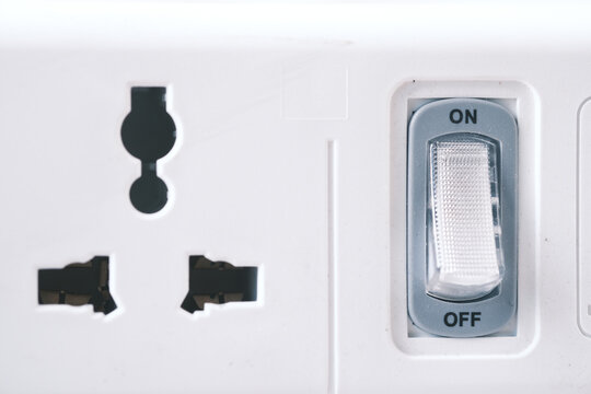 Electrical switch and plug on color background,
