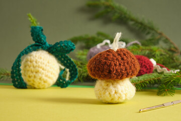 handmade. knitted balls for the Christmas tree, crocheted Christmas tree toys in the shape of a mushroom