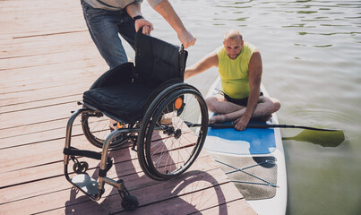 Person with a physical disability ride on sup board