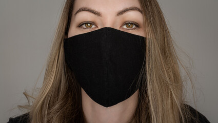 Girl in a black protective mask