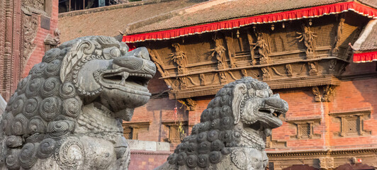 Panorama of stone lion sculptures on Durbar square in Kathmandu, Nepal