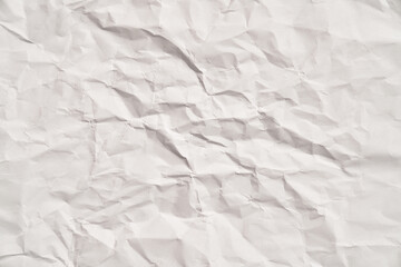 White crumpled paper texture with wrinkles. Damaged and torn sheet