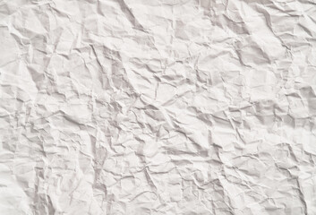 White crumpled paper texture with wrinkles. Damaged and torn sheet