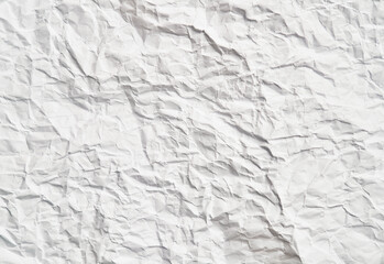 White crumpled paper texture with wrinkles. Damaged and torn sheet