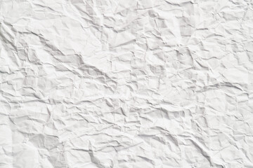 White crumpled paper texture with wrinkles. Damaged and torn sheet