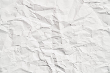 White crumpled paper texture with wrinkles. Damaged and torn sheet