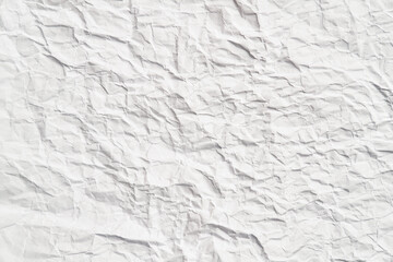 White crumpled paper texture with wrinkles. Damaged and torn sheet