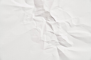 White crumpled paper texture with wrinkles. Damaged and torn sheet