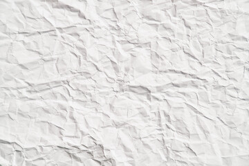 White crumpled paper texture with wrinkles. Damaged and torn sheet