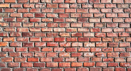 Brick wall texture with cracked tiles and cement. Classic brickwall surface background