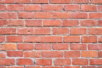 Brick wall texture with cracked tiles and cement. Classic brickwall surface background