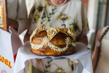 one of the Russian traditions at the wedding is to meet the newlyweds with a loaf of bread