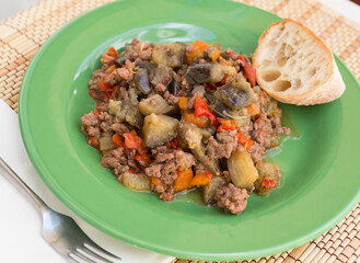 dish of vegetable stew. stewed eggplant, minced meat, carrots, peppers, onion squid